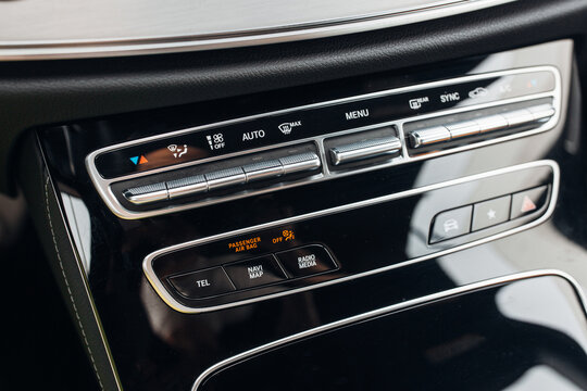 Climate control panel in modern car. Knobs and dashboard panel 