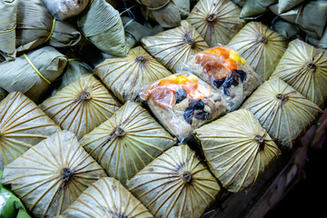 Top view of Zongzi, The glutinous rice wrapped in Lotus leaf, focus selective