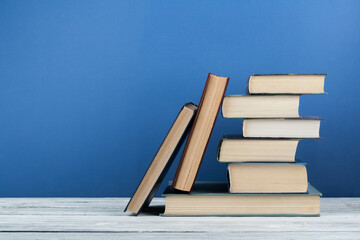 Stack of colorful books. Education background. Back to school. Book, hardback colorful books on...