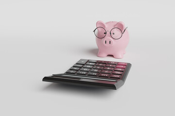 Pink piggy bank wearing a pair of spectacles in front of a black calculator on white background. Illustration of the concept of bank savings, stock investment and accountancy