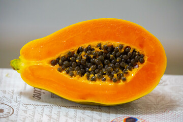 Beautiful cut ripe papaya showing seeds and ripe pulp