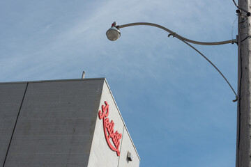 Fototapeta premium street lamp and exterior building and sign of Redpath Sugar Refinery located at 95 Queens Quay East in downtown Toronto, Canada