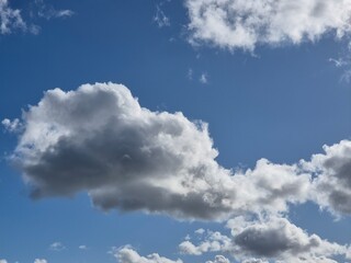 White fluffy clouds in the sky background. Cumulus clouds