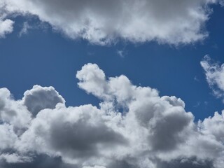 White fluffy clouds in the sky background. Cumulus clouds