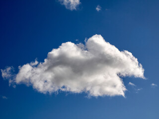 Naklejka na ściany i meble Cumulus clouds in the sky. Fluffy cloud shapes