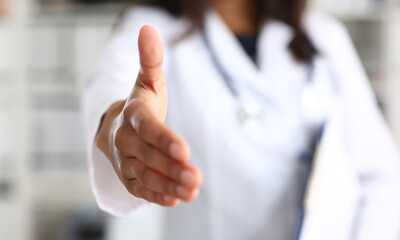 Doctor shake hand as hello with patient in office closeup. Welcoming friend introduction or thanks gesture consultation work thankful client talk team trust communication teamwork deal concept