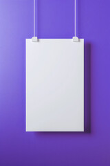 a white blank canvas hanging on a clean purple color wall