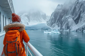  A cruise ship passenger enjoying a view of glaciers and icebergs in a polar region © create