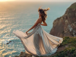 A woman in a long dress is standing on a cliff overlooking the ocean. She is wearing a white dress and her hair is blowing in the wind. The scene is serene and peaceful
