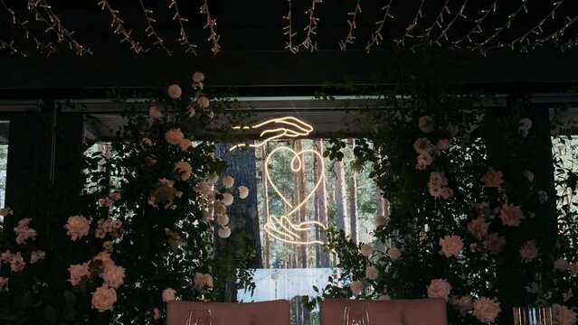 wedding wedding decor with greenery and neon heart