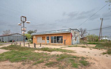 Old abandoned brick gas station in Loop, Texas, United States