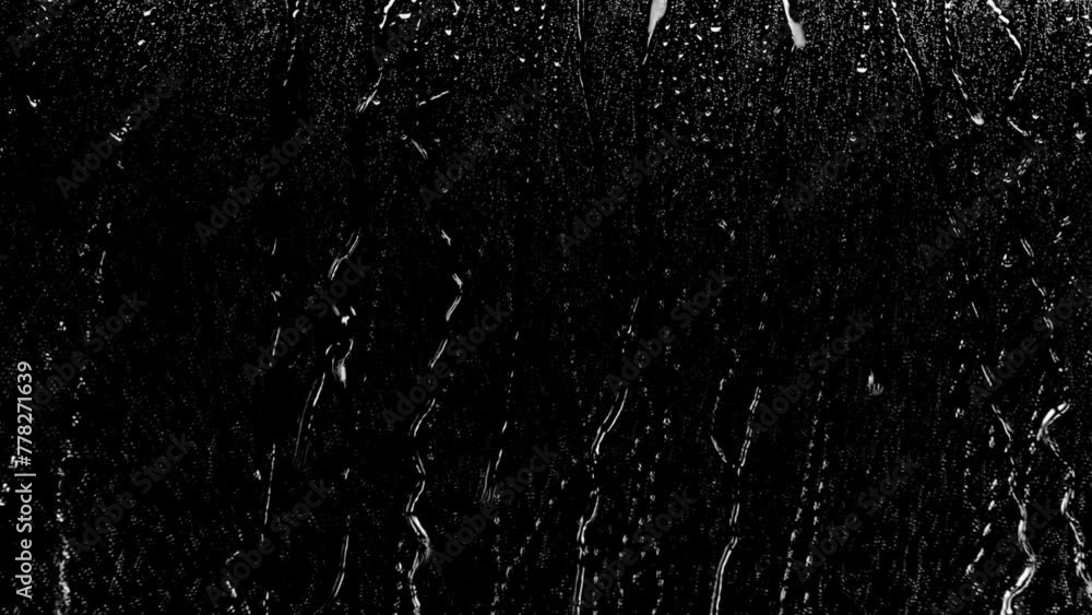 Wall mural rain drop video on black background