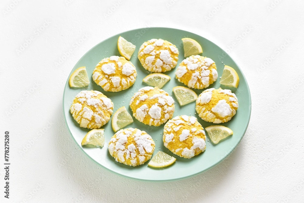 Wall mural homemade lemon crinkle cookies on white background. close up view