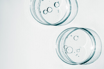 Petri dish. Petri cups with liquid. Kit. Chemical elements, oil, cosmetics. Gel, water, molecules,...