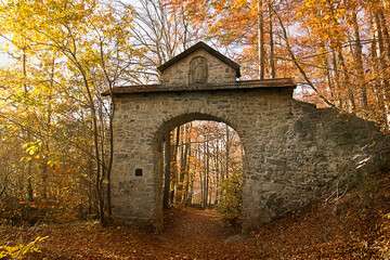Autumn landscape ancient ruins in an autumnal forest