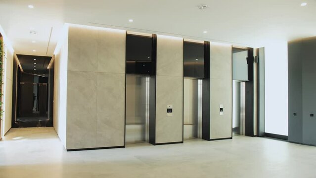 a row of elevators are lined up in a building