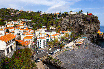 Ponta do Sol in Madeira Island, Portugal. Aerial drone view at cityscape of coastal town and beach - 778291013