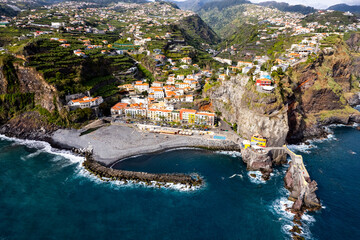 Ponta do Sol in Madeira Island, Portugal. Aerial drone view at cityscape of coastal town and beach - 778291299