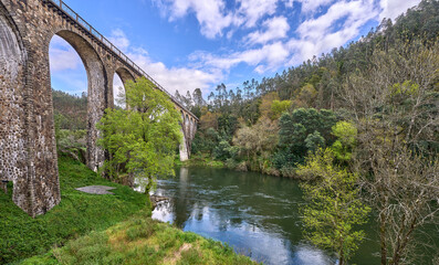 picturesque old railway bridge Pessegueiro do Vouga over Vouga River near Aveiro, Portugal