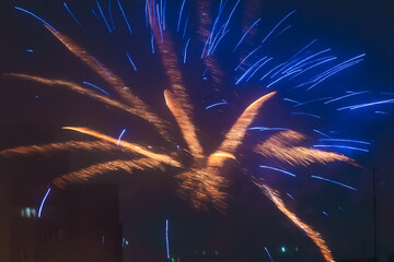 Beautiful colorful fireworks against a dark sky background. Selective focus, background, texture