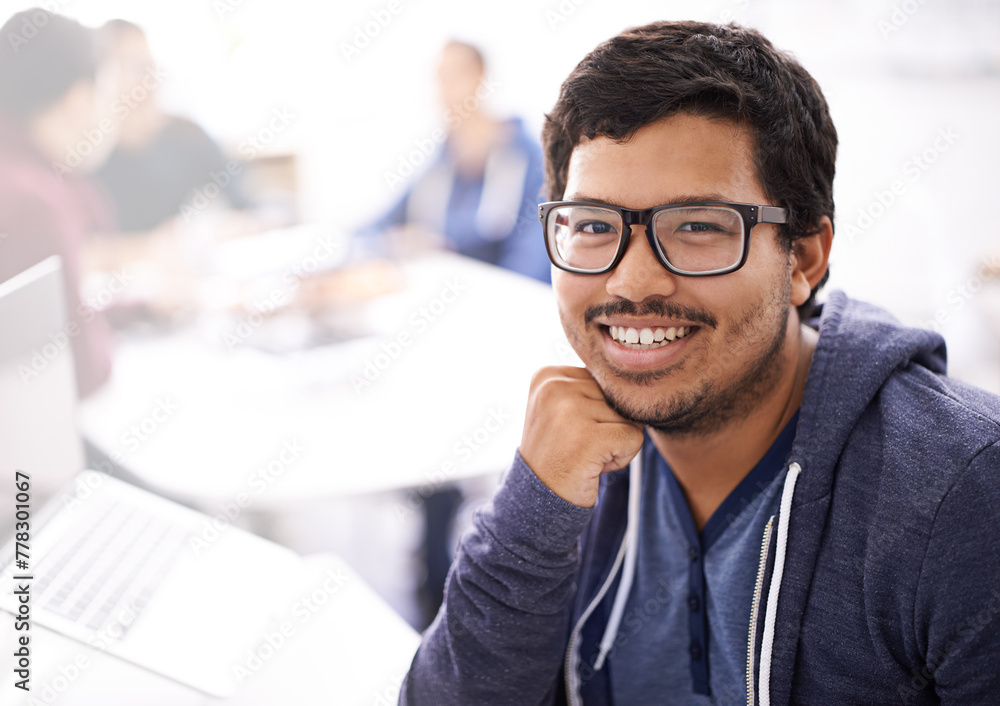 Poster IT professional, smile and portrait in office with laptop for information technology innovation, web development and programming. Indian person or programmer with tech for database business software