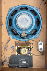 The inside of an old speaker