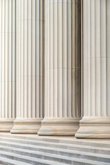 Architectural detail of some neoclassic columns in a row. - obrazy, fototapety, plakaty