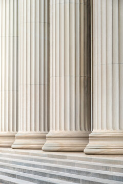 Architectural detail of some neoclassic columns in a row.