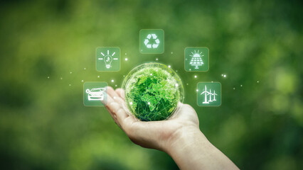Green Technology. Globe on palm with icons and green background. green technology concept Using technology that preserves the environment and investing in green businesses