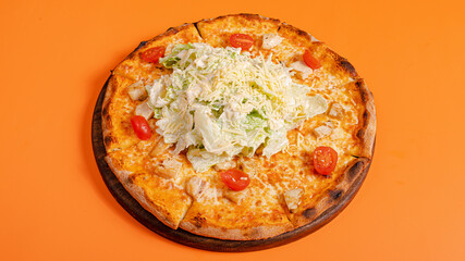 Caesar pizza isolated on orange background