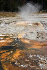 Steam and boiling water in the geothermal area in the Yellowstone National Park Wyoming USA
