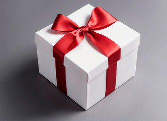 A classic white gift box tied with an elegant red satin ribbon, presenting a timeless and chic look.