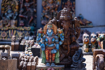 A handmade wooden idol of Lord Vishnu sounds like a beautiful tribute to the deity's revered presence in Hindu mythology and culture.  - obrazy, fototapety, plakaty