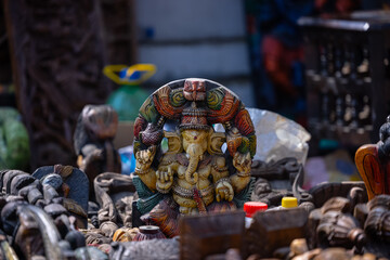 A handmade wooden idol of Lord Ganesh sounds like a beautiful tribute to the deity's revered presence in Hindu mythology and culture. 