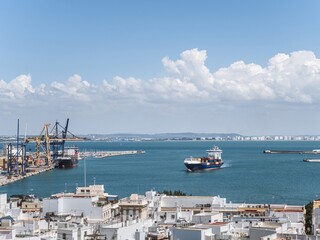 A large container cargo transport ship arriving to the port harbor of Cadiz, Andalusia, Spain © MatyasSipos