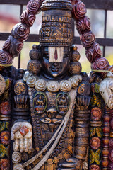 A handmade wooden idol of Lord Tirupati Balaji sounds like a beautiful tribute to the deity's revered presence in Hindu mythology and culture. 