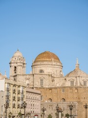 Fototapeta na wymiar View along the sea wall and Avenido Campo del Sur, including the Cathedral, Cadiz.