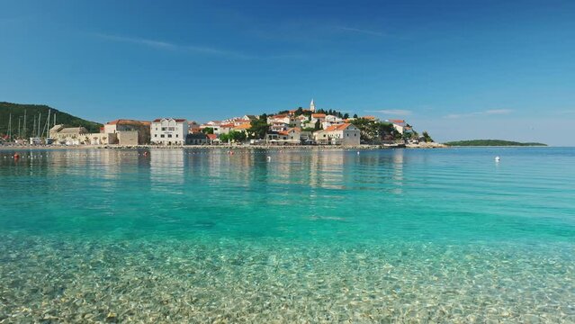 Idyllic beach near the charming Primosten town, Adriatic Sea in Croatia
