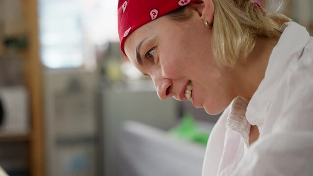 Smiling Baker in Red Bandana Enjoying the Art of Pie Making in a Bright Kitchen