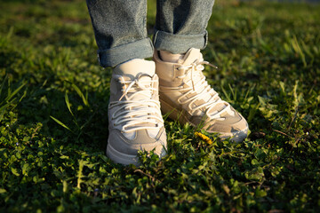  Closeup on shoe with rolled up jeans.