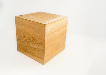 large cube of european oak wood  isolated on a white background