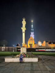 Jasna Gora Monastery and the column with the Blessed Virgin Mary in Czestochowa at night. The...