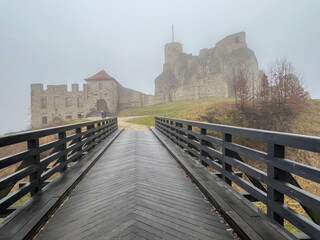 Castle ruins in Rabsztyn in Poland in rainy and foggy weather. The facility near Olkusz on the Eagle's Nests trail on the Krakow-Czestochowa Upland - 778351273
