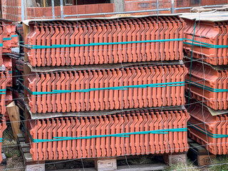 Roof tiles stacked on a pallet, visible from the side as a background - 778352282