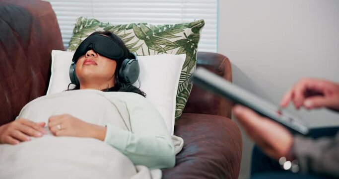 Psychology, counseling and woman on sofa with headphones, relax or psychedelic treatment for anxiety, trauma or stress. Mental health, psilocybin therapy and person on couch for alternative medicine