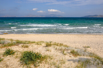 Beautiful Marmari beach with golden sand and emerald waters. Kos island, Greece