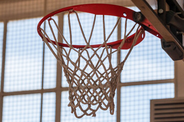 Basketball rim board. Through the window grid. Glass frame. Square shapes. Hoop, NBA hang time.
