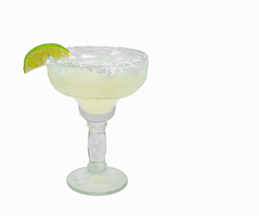 Margarita drink on ice with a lime wedge and rock salt on the brim isolated on White with copy space.
