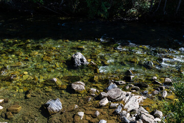 River with rocks as background of Lleida, Catalonia, Spain