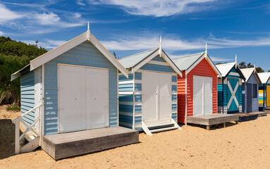 Beautiful bathing houses on white sandy beach at Brighton in Melbourne, Australia. - obrazy, fototapety, plakaty